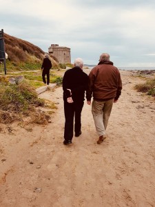 Elderly-men-peaceful-walking-at-beach