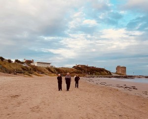 Picture-of-elderly-gentlemen-walking-on-beach